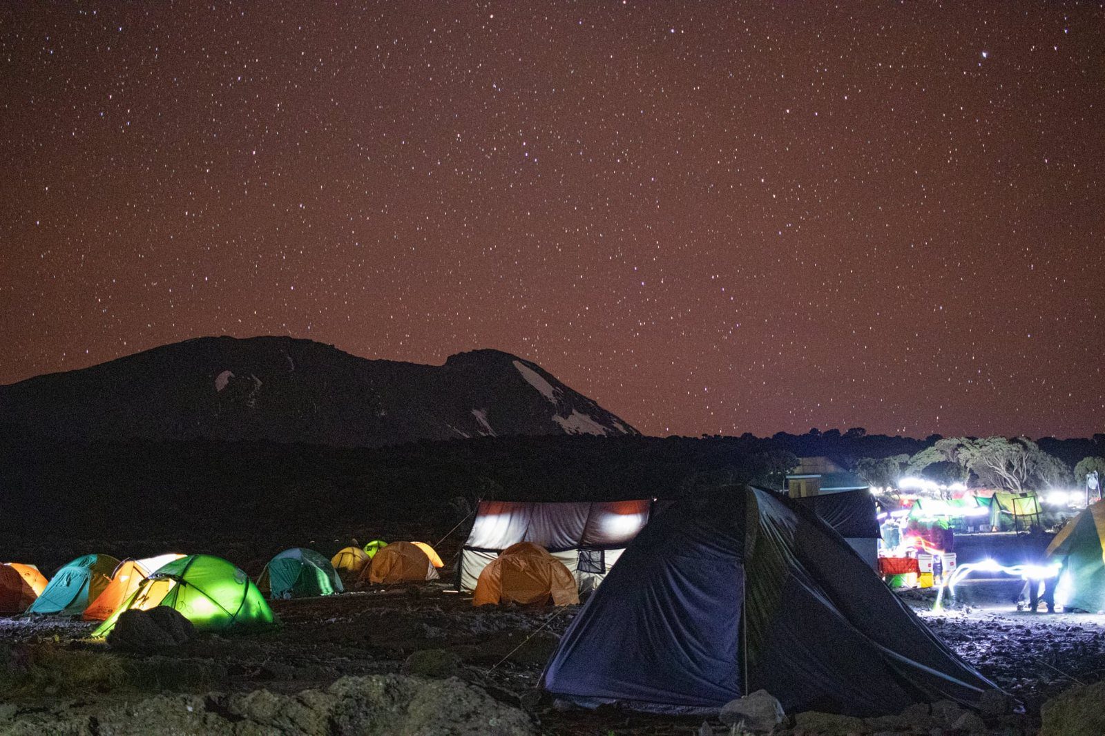Evening camp atmosphere with climbers and tents