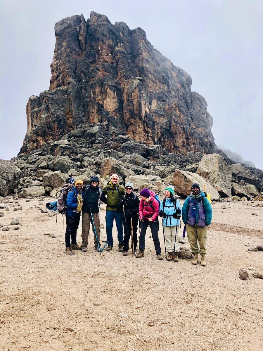Group photo on Kilimanjaro rocky summit terrain