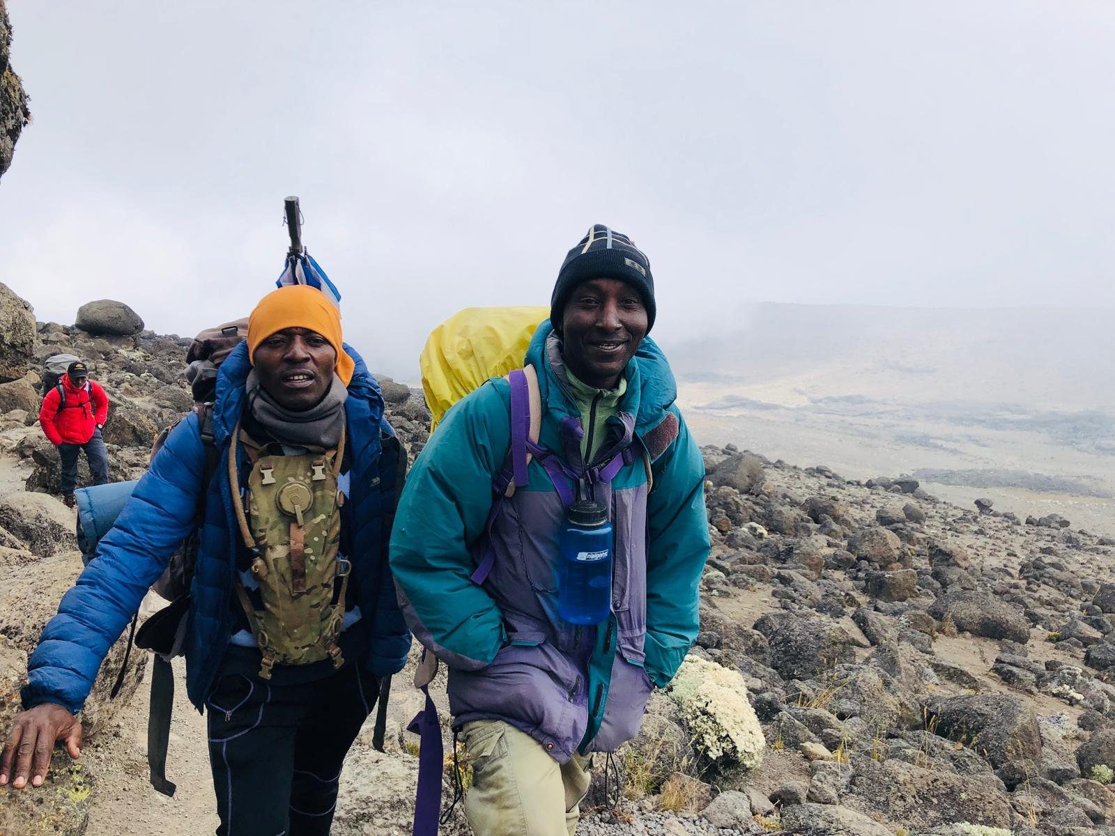 Two climbers dressed warmly for Kilimanjaro summit day